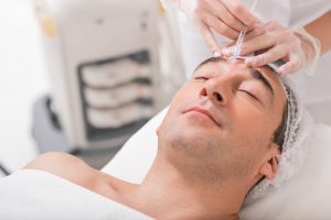 man undergoing facial rejuvenation procedure