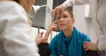 woman having nose examined