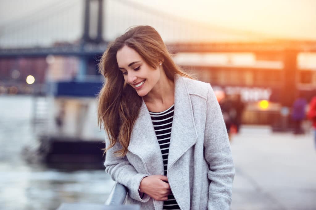 Beautiful,Happy,Woman,Walking,Near,East,River,In,New,York